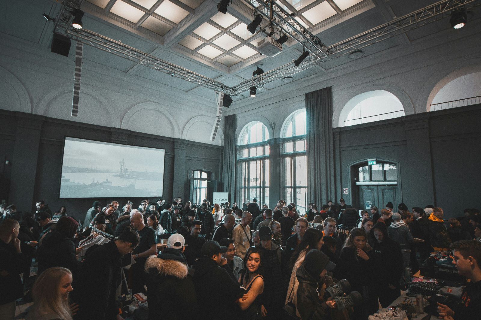Crowded event with vendors and attendees